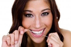 Woman smiling confidently after receiving dental crown services in Ogden, UT