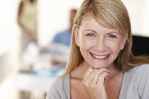 Happy patient with full arch implant solutions
