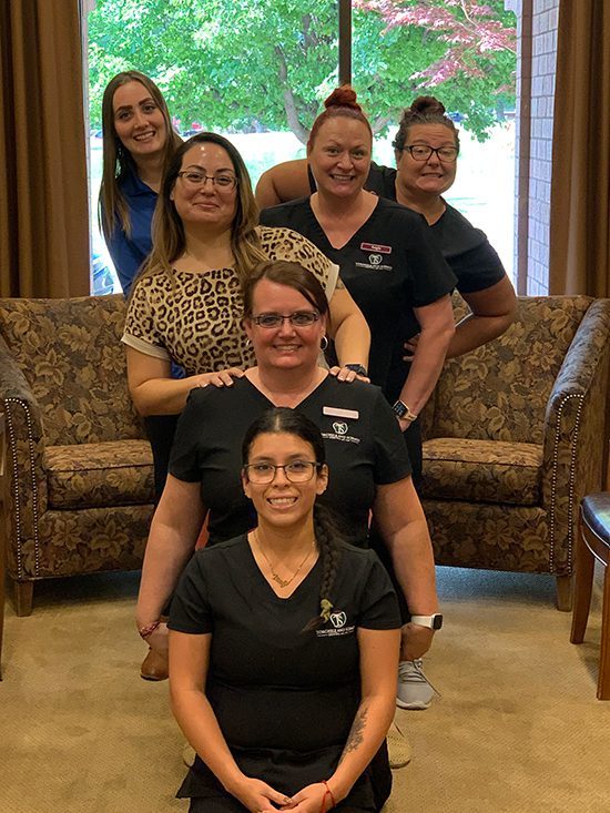 Torghele Dentistry Team smiling together in Ogden, UT